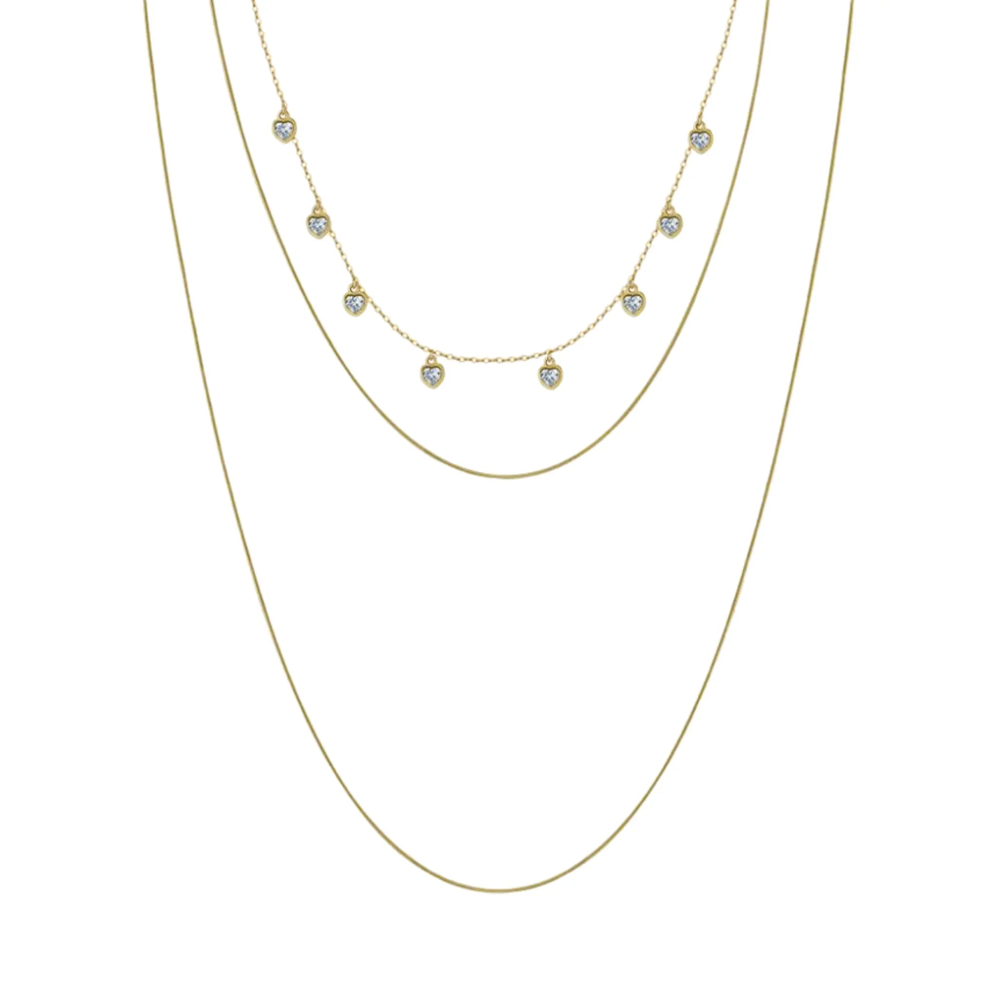 Dreilagige goldene Halskette mit kleinen runden Anhängern und minimalistischem Design