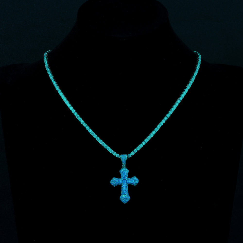 Blue Frosty Cross Pendant with a blue gemstone and VVS Moissanite, paired with a tennis chain, displayed elegantly on a jewelry holder.