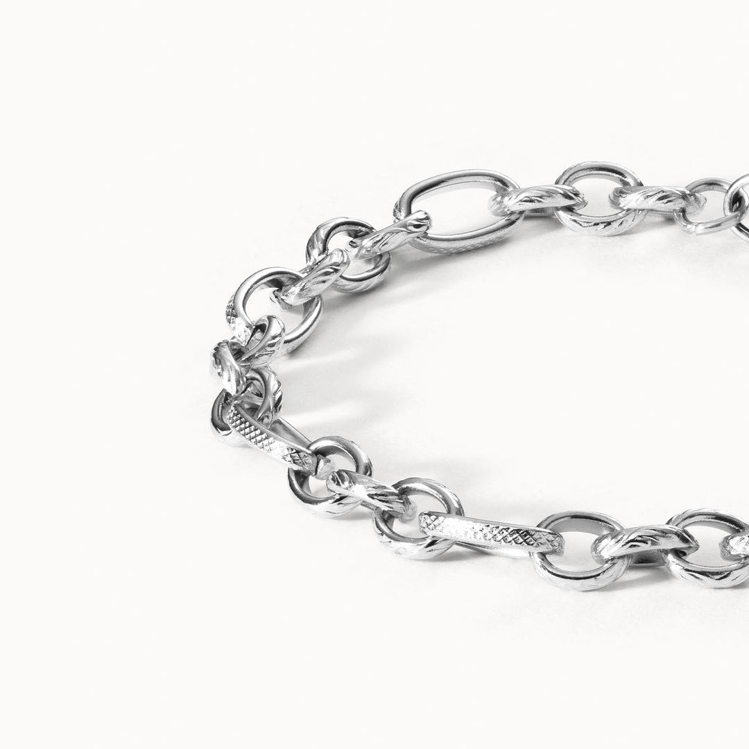 Close-up of PURELEI’s silver stainless steel Fashion Show Bracelet with matte finish and adjustable links.