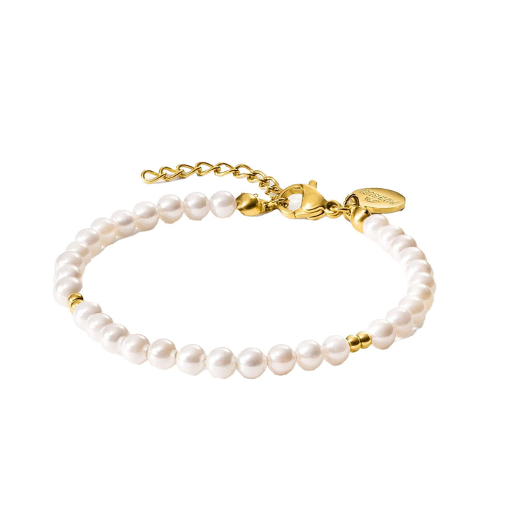 Close-up of an elegant 18K gold-plated Finesse Bracelet by PURELEI featuring small freshwater pearl embellishments and adjustable links.