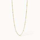Ultra Close-up of PURELEI Li'ili'i Necklace Gold, a delicate 18K gold-plated chain perfect for layering with an adjustable length.
