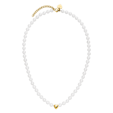 Overhead view of the PURELEI Lovely Necklace in gold, showcasing its full length, heart pendant, and mix of seashell and glass pearls.