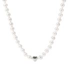 Close-up of the PURELEI Lovely Necklace in silver, featuring a heart pendant and a mix of seashell and glass pearls for an elegant look.