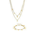 Close-up of the PURELEI Luna Set in gold, featuring a moon phase necklace and matching bracelet with delicate moon-shaped charms.